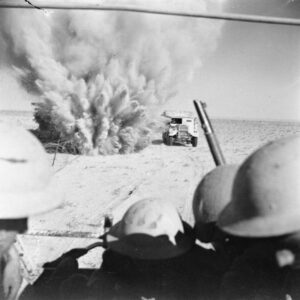 An explosion next to a tank in the dessert.