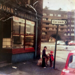 Children standing outside of the fish and chip shop.