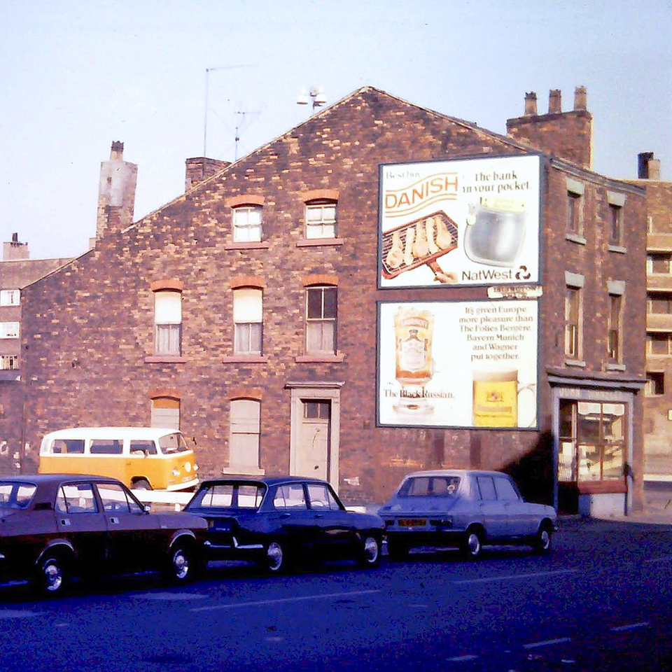 A brick building with a sign on it.